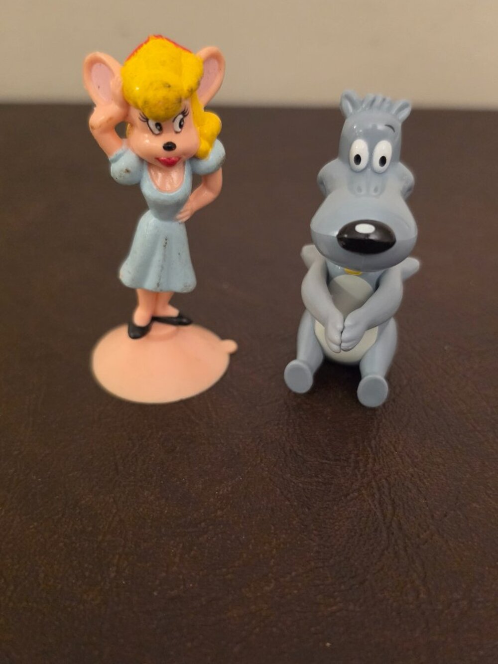 Vintage figure featuring characters from Mighty Mouse and Doug's Pork Chop.